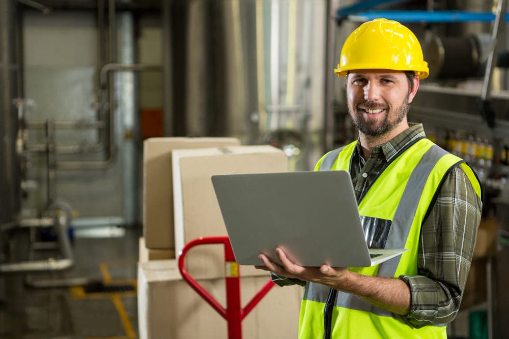 A supply chain manager reviewing a network map of suppliers, ports and transport routes